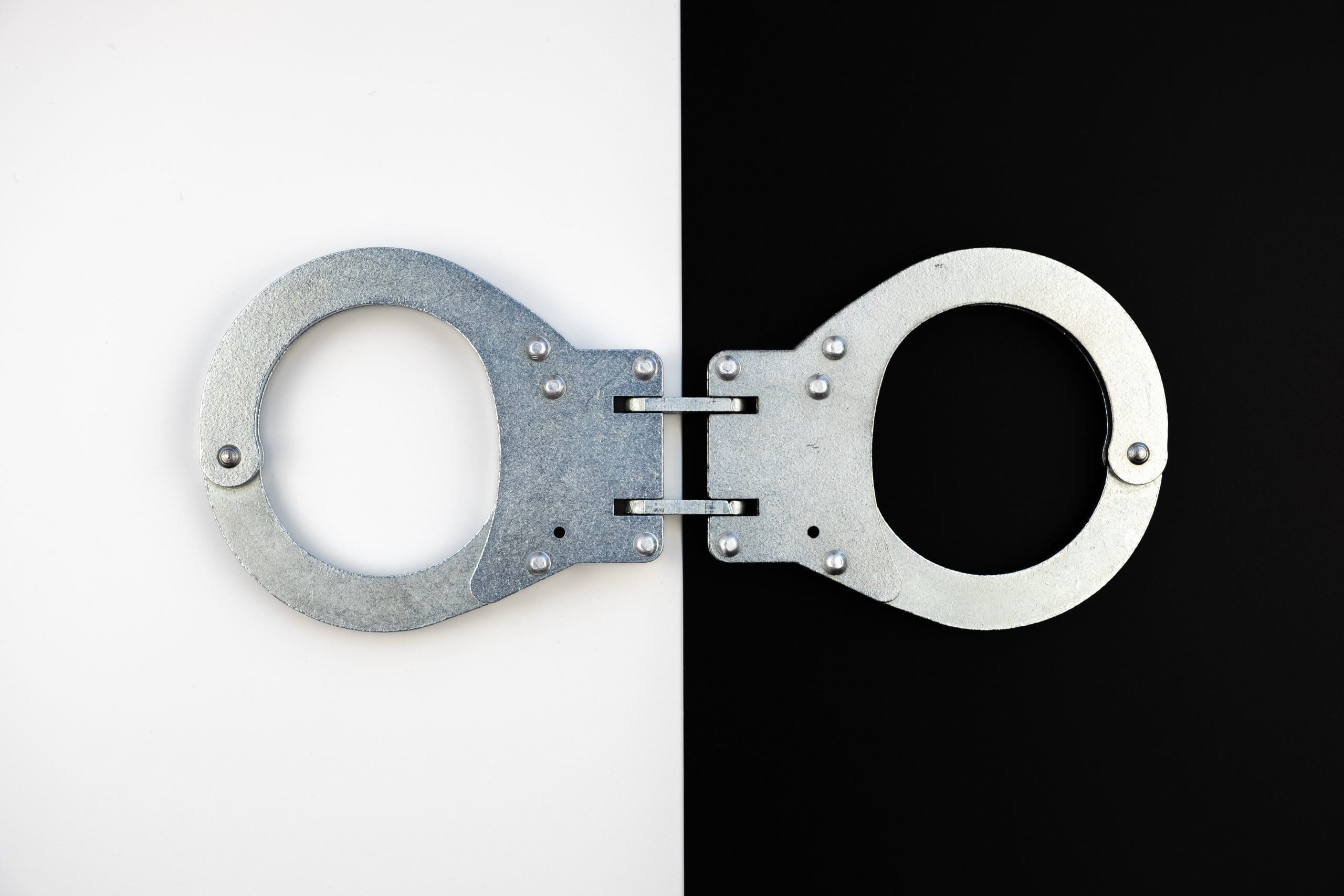 Handcuffs on a black and white background.